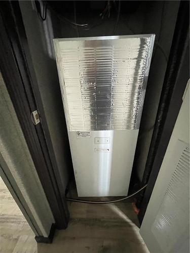 Electric forced air furnace with central air - E10 1545 Main Street E, Swan River, MB - Indoor Photo Showing Basement