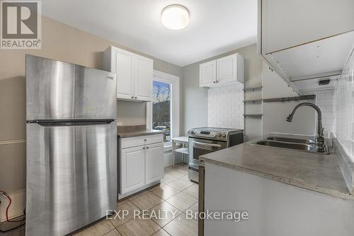 Upper - 129 Grant Avenue, Hamilton, ON - Indoor Photo Showing Kitchen With Double Sink