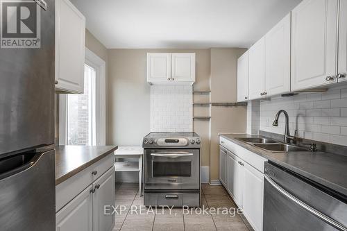 Upper - 129 Grant Avenue, Hamilton, ON - Indoor Photo Showing Kitchen With Double Sink