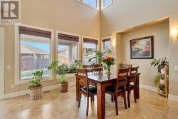 Beautiful Dining Room With Lots Of Natural Sunlight and High Ceilings - 