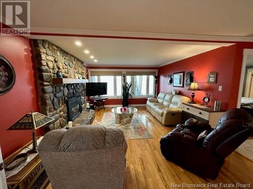 13 Trepanier, Mcleods, NB - Indoor Photo Showing Living Room With Fireplace
