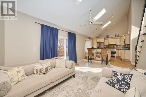 The bright living area with 3 skylights! - 12 Brigantine Court, St. Catharines (Port Weller), ON - Indoor Photo Showing Living Room