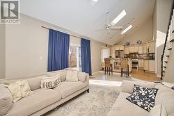 The bright living area with 3 skylights! - 