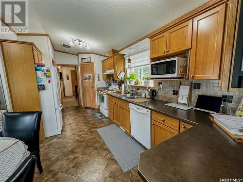 107 May Street, Neudorf, SK - Indoor Photo Showing Kitchen With Double Sink