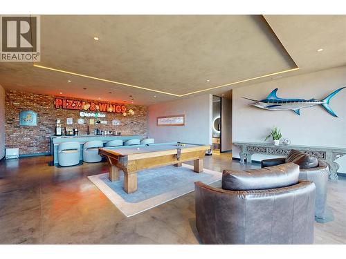 Time for fun! Expansive rec room complete with a bar! - 4275 Todd Road, Kelowna, BC - Indoor Photo Showing Other Room