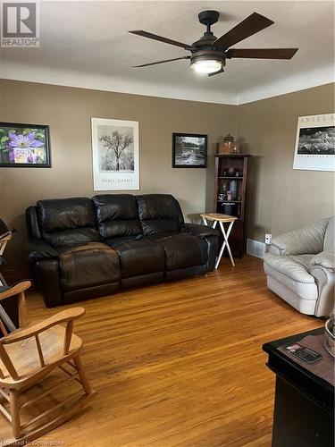 Living room with light wood-style flooring and a ceiling fan - 627 Upper Sherman Avenue, Hamilton, ON - Indoor Photo Showing Living Room