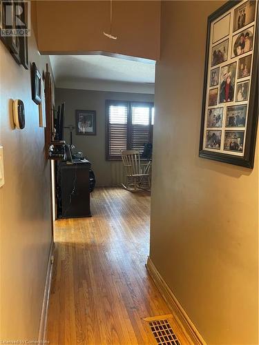 Hallway with hardwood / wood-style flooring and baseboards - 627 Upper Sherman Avenue, Hamilton, ON - Indoor Photo Showing Other Room