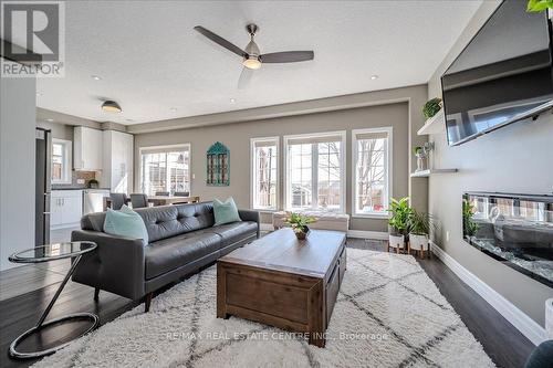 932 Eden Oak Court, Kitchener, ON - Indoor Photo Showing Living Room With Fireplace