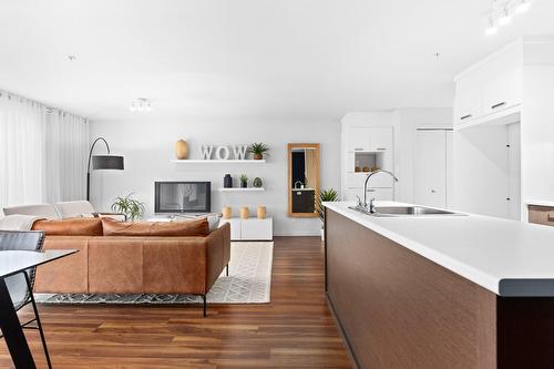 Living room - 103A-150 Rue De La Maçonnerie, Châteauguay, QC - Indoor With Fireplace