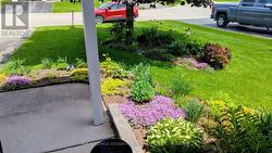 Pretty flowerbed view from entry to home - 