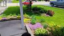 Pretty flowerbed view from entry to home - 264 Glenwood Crescent, Smiths Falls, ON  - Outdoor 