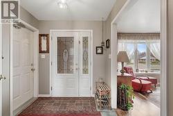 Inside access to garage from tiled Foyer. - 