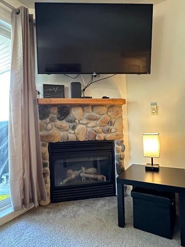 210-4767 Forsters Landing Road, Radium Hot Springs, BC - Indoor Photo Showing Living Room With Fireplace