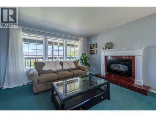 445 5 Road, Oliver, BC - Indoor Photo Showing Living Room With Fireplace