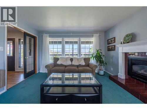 445 5 Road, Oliver, BC - Indoor Photo Showing Living Room With Fireplace
