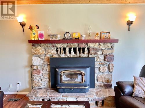 1715 33 Highway, Rock Creek, BC - Indoor Photo Showing Living Room With Fireplace