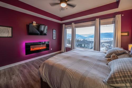 1114 Holden Road, Penticton, BC - Indoor Photo Showing Bedroom With Fireplace