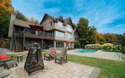 Back facade - 5 Rue Champoux, Sainte-Béatrix, QC - Outdoor With In Ground Pool