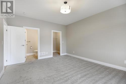 Primary Bedroom with Walk in Closet - 9 Ben Tekamp Terrace, Brockville, ON - Indoor Photo Showing Other Room