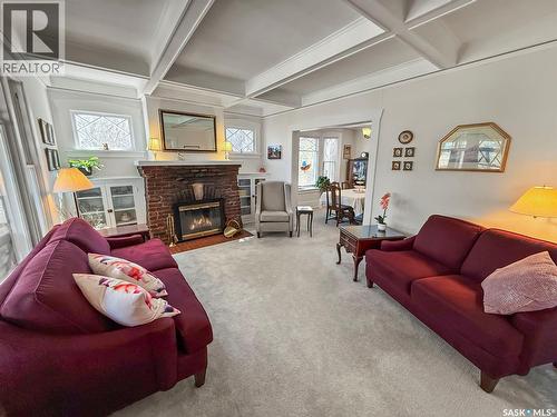570 4Th Avenue Ne, Swift Current, SK - Indoor Photo Showing Living Room With Fireplace