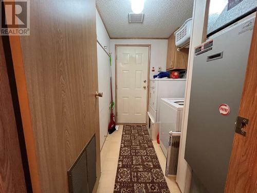 laundry area/hall to side/back door - 5484 25 Avenue Unit# 123, Vernon, BC 