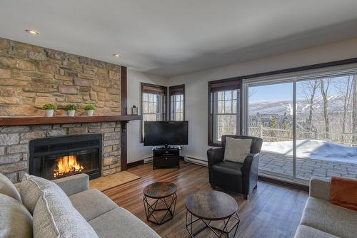 Living room - 1-250 Rue Du Mont-Plaisant, Mont-Tremblant, QC - Indoor Photo Showing Living Room With Fireplace