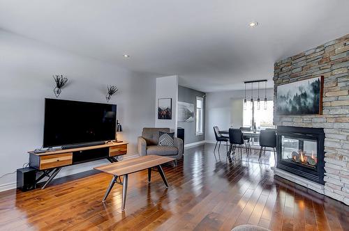 Salon - 592 Rue Toulouse, Repentigny (Repentigny), QC - Indoor Photo Showing Living Room With Fireplace
