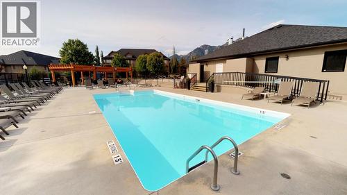 400 Bighorn Boulevard Unit# 412 A, Radium Hot Springs, BC - Outdoor With In Ground Pool With Deck Patio Veranda