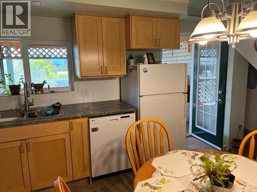 Kitchen Door to Covered Deck - 1121 Erickson Road, Creston, BC - Indoor Photo Showing Kitchen