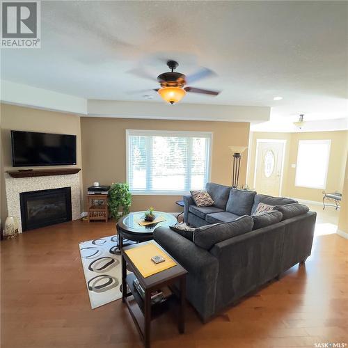 82 Estates Drive, Elk Ridge, SK - Indoor Photo Showing Living Room With Fireplace