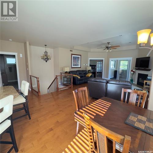 82 Estates Drive, Elk Ridge, SK - Indoor Photo Showing Dining Room With Fireplace