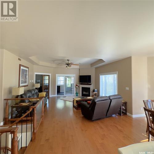 82 Estates Drive, Elk Ridge, SK - Indoor Photo Showing Living Room With Fireplace
