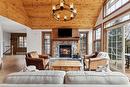 Living room - 9-134 Ch. De La Forêt, Mont-Tremblant, QC  - Indoor Photo Showing Living Room With Fireplace 