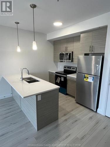 4785 Walker Road Unit# 308, Windsor, ON - Indoor Photo Showing Kitchen With Double Sink With Upgraded Kitchen