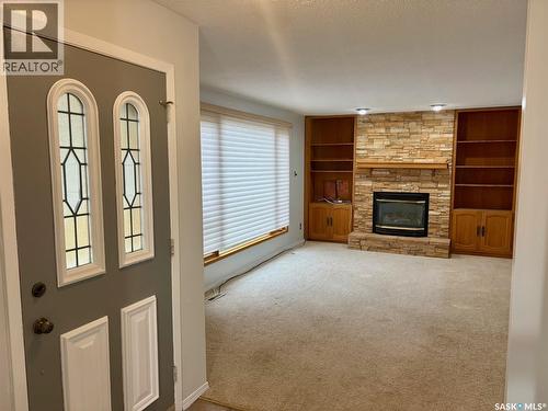 506 Grant Bay, Esterhazy, SK - Indoor Photo Showing Other Room With Fireplace