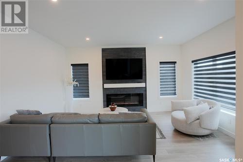 4154 Fieldstone Way, Regina, SK - Indoor Photo Showing Living Room With Fireplace