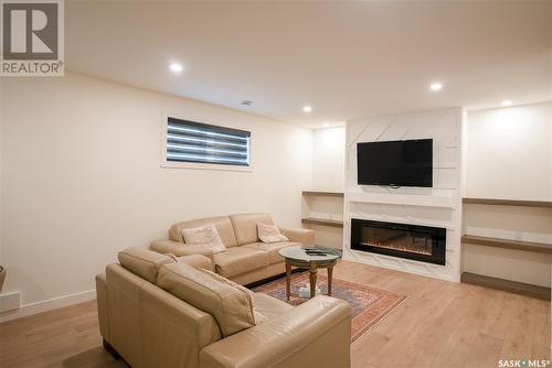 4154 Fieldstone Way, Regina, SK - Indoor Photo Showing Basement With Fireplace