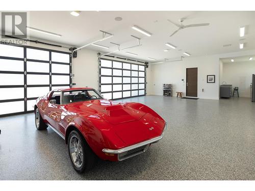 Spacious garage with epoxy floors - 2463 Thacker Drive, West Kelowna, BC - Indoor Photo Showing Garage