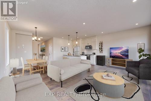 VIRTUALLY STAGED - 102 Thackeray Way, Minto, ON - Indoor Photo Showing Living Room