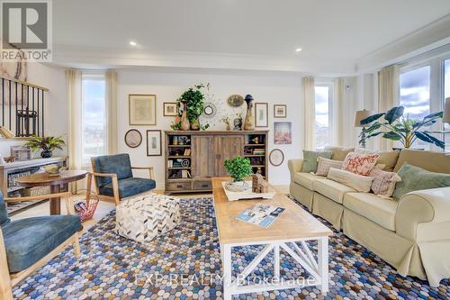 Photos of same floorpan previously built - 109 Thackeray Way, Minto, ON - Indoor Photo Showing Living Room
