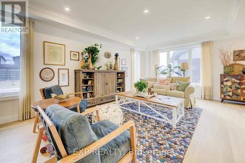 Photos of same floorpan previously built - 109 Thackeray Way, Minto, ON - Indoor Photo Showing Living Room