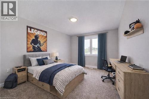 Virtaully staged - 102 Thackeray Way, Harriston, ON - Indoor Photo Showing Bedroom