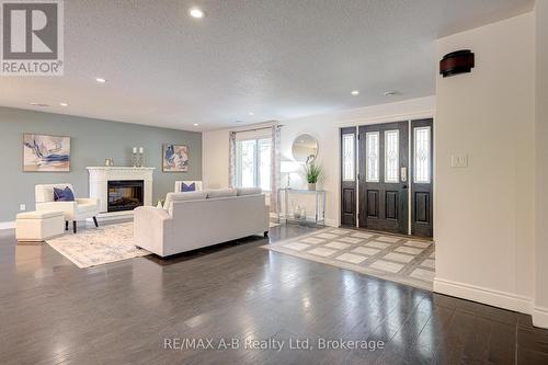 197 Trafalgar Street N, West Perth (Mitchell), ON - Indoor Photo Showing Living Room With Fireplace