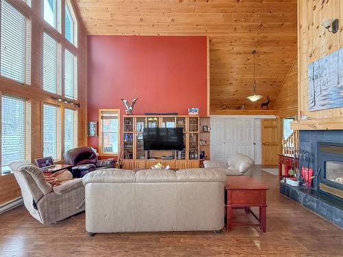 67 Hilltop Crescent, Onanole, MB - Indoor Photo Showing Living Room With Fireplace