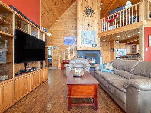 67 Hilltop Crescent, Onanole, MB - Indoor Photo Showing Living Room With Fireplace