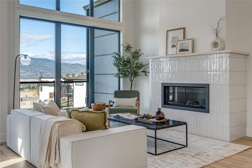 102-1100 Antler Drive, Penticton, BC - Indoor Photo Showing Living Room With Fireplace