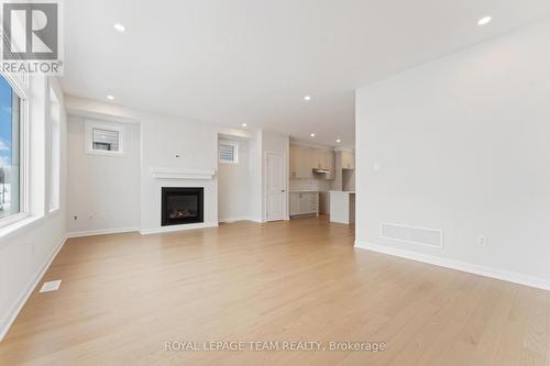 718 Jennie Trout Terrace, Ottawa, ON - Indoor Photo Showing Other Room With Fireplace