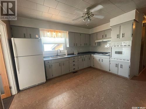 22 West Road, Kindersley, SK - Indoor Photo Showing Kitchen With Double Sink