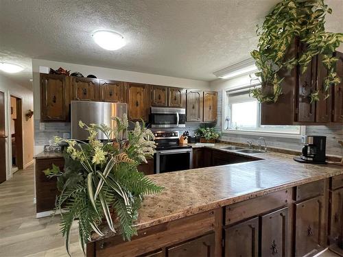 268 Hwy &  #10 Highway N, Swan River, MB - Indoor Photo Showing Kitchen With Double Sink