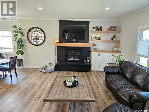 5 Souris Avenue, Redvers, SK - Indoor Photo Showing Living Room With Fireplace